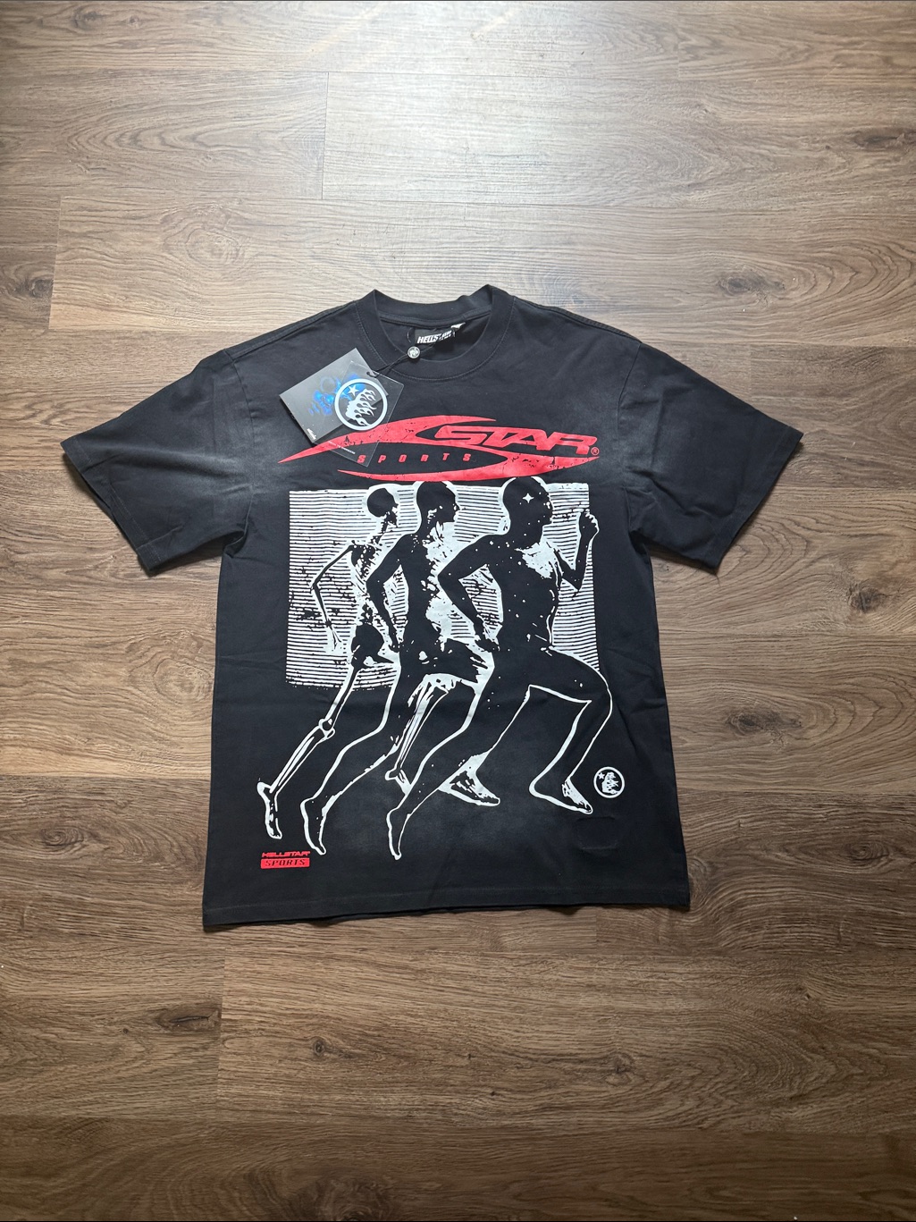 Hellstar Black Tee With Red Logo And White Runner Graphic